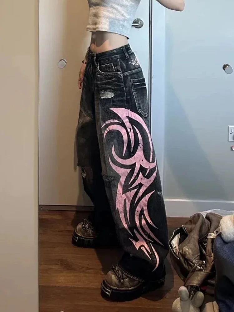 Person wearing black alternative fashion statement pants with pink cyber design and platform shoes