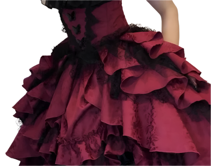 Detailed close-up of an affordable lolita outfit for women featuring layered ruffled burgundy fabric with black lace accents