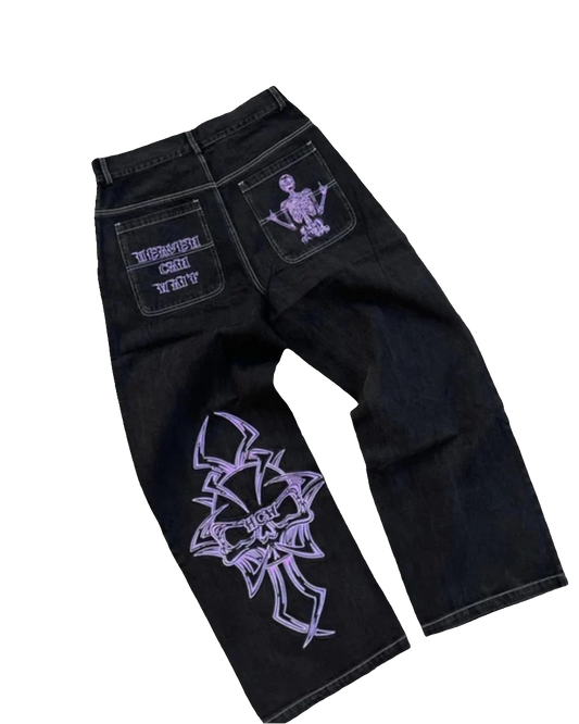 Black baggy jeans with graphic design featuring purple skeleton and text on back pockets and leg