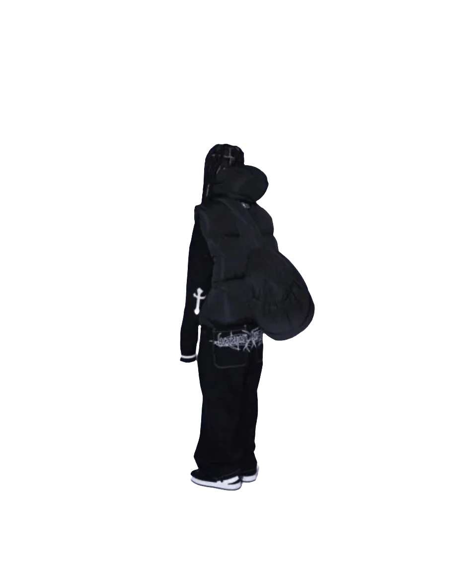 Person wearing black baggy jeans with graphic design paired with black hoodie and white sneakers