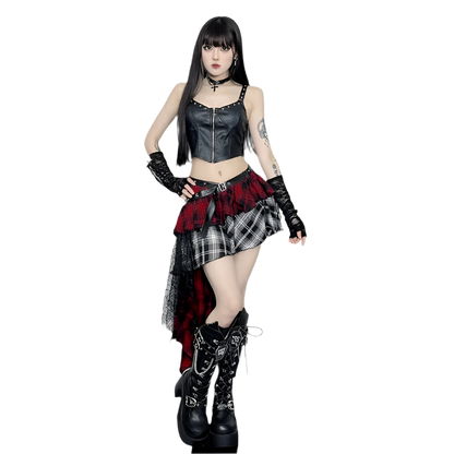 Model wearing irregular plaid skirt with red and black patterns paired with black leather top and boots