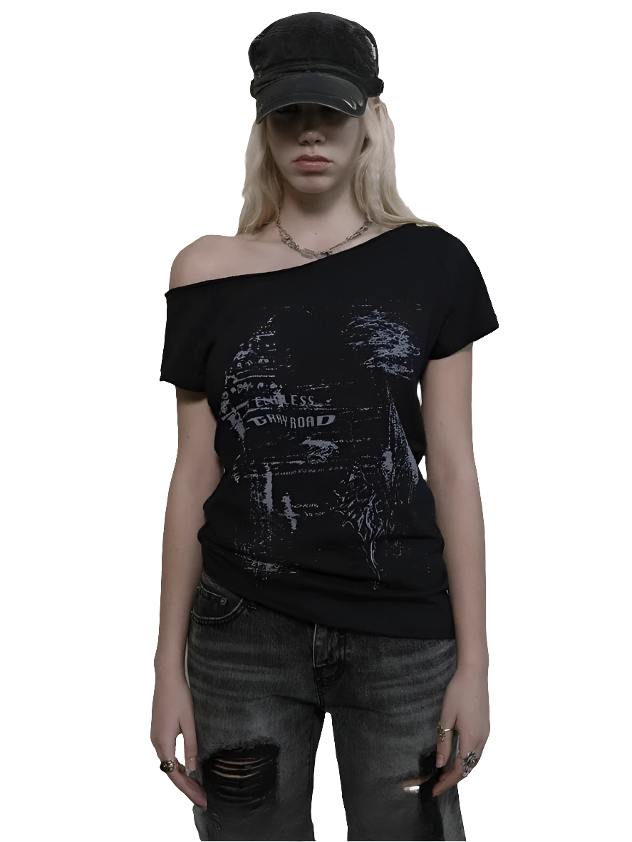 Weird0z black off shoulder cyber tee with futuristic graphic worn with distressed jeans and a black cap