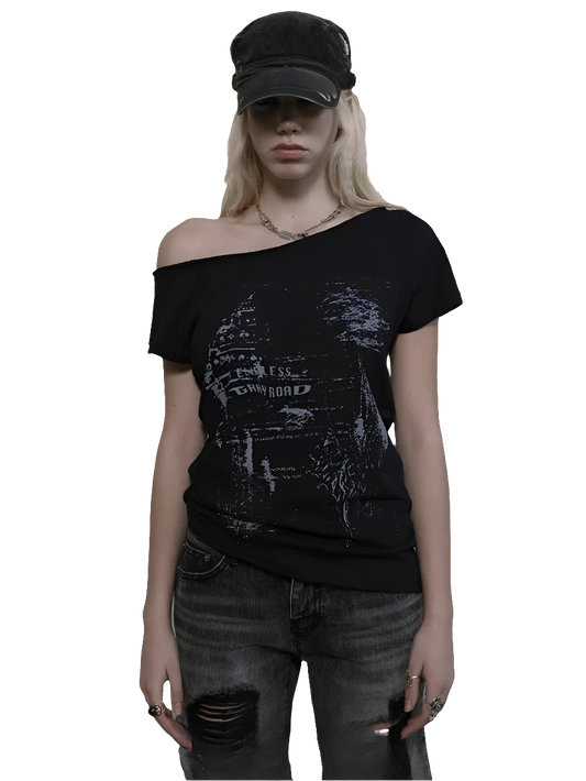 Weird0z black off shoulder cyber tee with futuristic graphic worn with distressed jeans and a black cap