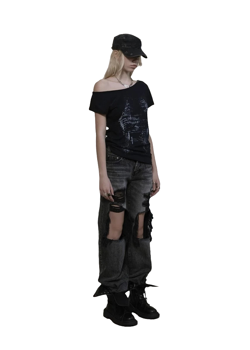 Model wearing weird0z off shoulder cyber tee with distressed black jeans and black cap