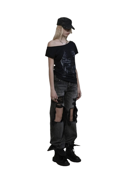 Model wearing weird0z off shoulder cyber tee with distressed black jeans and black cap