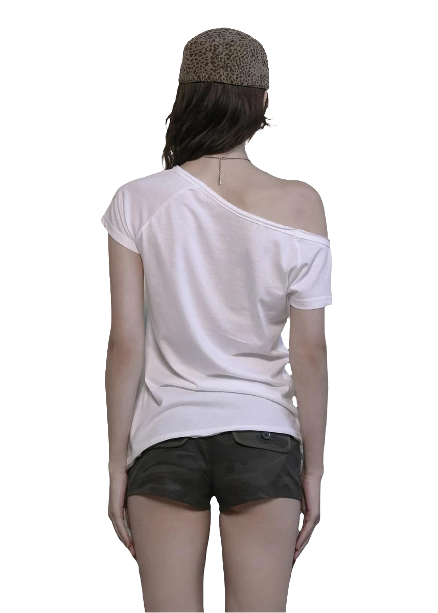 Back view of woman wearing white off shoulder cyber tee with short sleeves and olive shorts