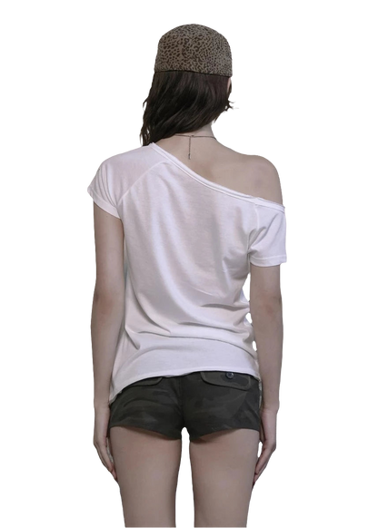 Back view of woman wearing white off shoulder cyber tee with short sleeves and olive shorts