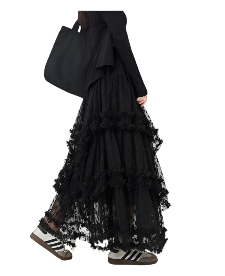 Black maxi ruffled lacey skirt with floral patterns worn with black top and sneakers