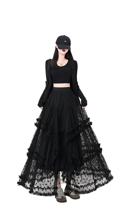 Woman wearing black maxi ruffled lacey skirt with layered design paired with black crop top and sneakers