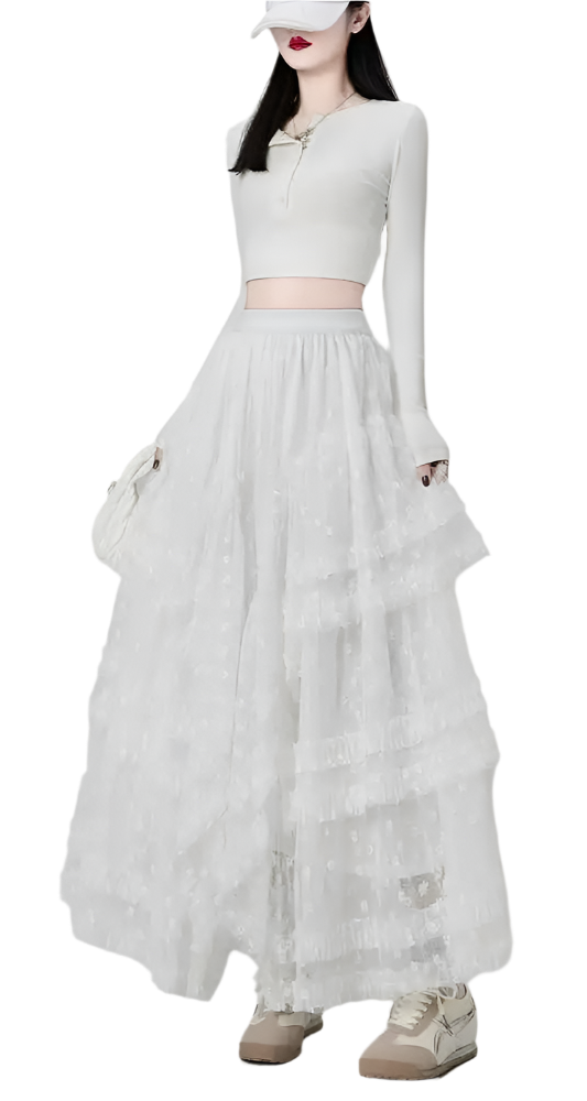White maxi ruffled lacey skirt styled with a long sleeve crop top and casual sneakers