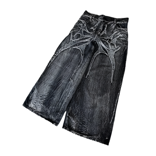 Black spider embroidered jeans with wide legs and textured fabric by weird0z