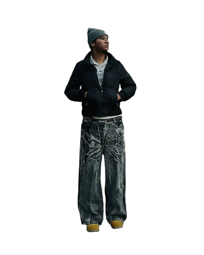Man wearing spider embroidered jeans from weird0z with large spider design and casual winter outfit