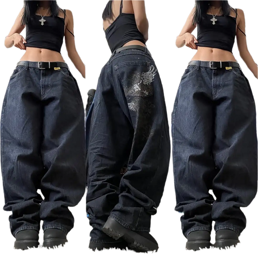 Weird0z women's oversized baggy jeans in black with distressed details worn with black crop top and chunky boots